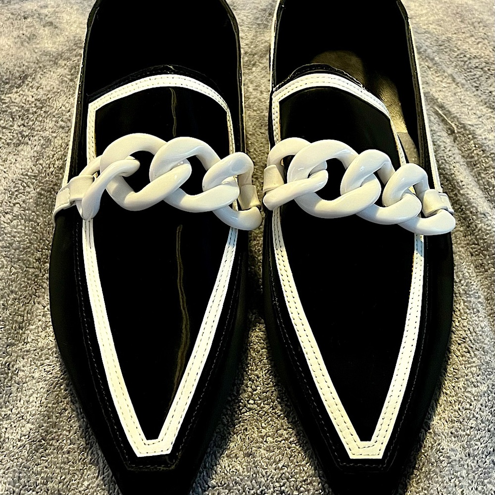 Black trimmed in white stylish, unique, flat style loafers